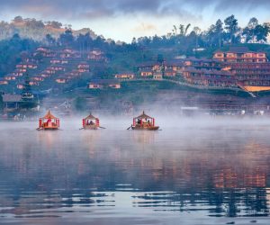 Tourists take a boat at Ban Rak Thai village in Mae Hong Son pro